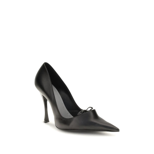 Balenciaga black lambskin pointed-toe pumps with a low-cut vamp, front bow, and sculptural high heel.